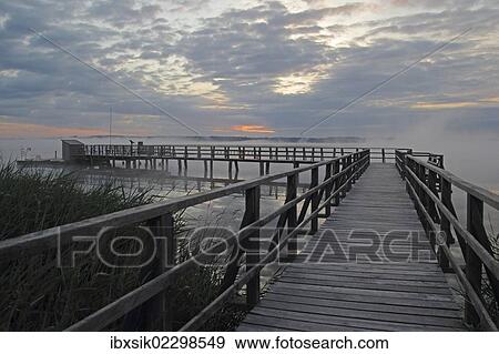 "Jetty at Federsee lake, Federsee lake nature reserve, morning mood, Baden-Wuerttemberg, Germany, Europe" View Large Photo Image Stock Photo - "Jetty at Federsee lake, Federsee lake nature reserve, morning mood, Baden-Wuerttemberg, Germany, Europe". Fotosearch