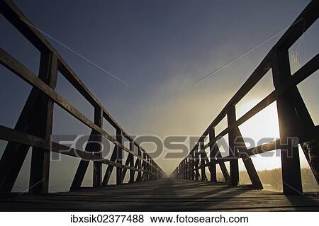 "Jetty, walkway at Federsee lake, sunrise, early morning, nature reserve, near Bad Buchau, Biberach district, Upper Swabia, Baden-Wuerttemberg, Germany, Europe" View Large Photo Image Stock Photo - "Jetty, walkway at Federsee lake, sunrise, early morning, nature reserve, near Bad Buchau, Biberach district, Upper Swabia, Baden-Wuerttemberg, Germany, Europe". Fotosearch