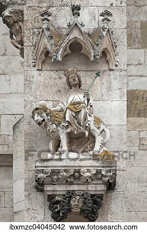 Stock Image - "Julius Caesar or Augustus on a unicorn with fallen horn, 14th century, main facade of the Cathedral of Regensburg, Regensburg, Upper Palatinate, Bavaria, Germany, Europe". Fotosearch
