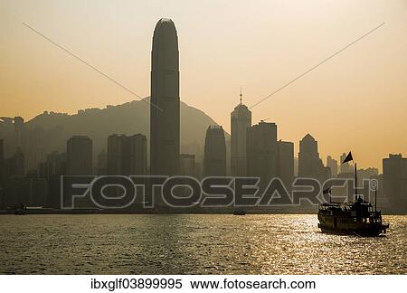"Junk in front of the skyline of Hong Kong Island with the skyscraper Two International Finance Centre, 2 IFC, in front of Victoria Peak in the morning light, Hong Kong, China, Asia" View Large Photo Image Stock Photography - "Junk in front of the skyline of Hong Kong Island with the skyscraper Two International Finance Centre, 2 IFC, in front of Victoria Peak in the morning light, Hong Kong, China, Asia". Fotosearch