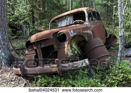"Junkyard in the forest, junk car, 40s, at Ryd, Smaland, Sweden, Europe" View Large Photo Image Stock Image - "Junkyard in the forest, junk car, 40s, at Ryd, Smaland, Sweden, Europe". Fotosearch