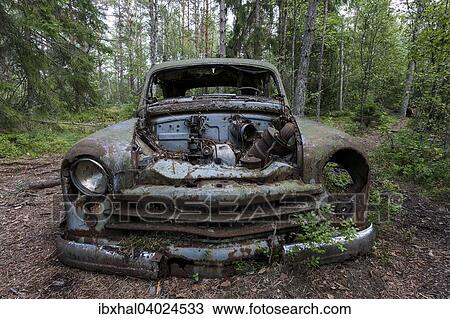 "Junkyard in the forest, junk car, 40s, at Ryd, Smaland, Sweden, Europe" View Large Photo Image Stock Image - "Junkyard in the forest, junk car, 40s, at Ryd, Smaland, Sweden, Europe". Fotosearch