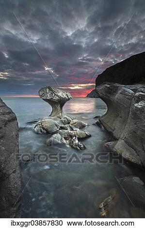 "Kannestein or Kanne Stone with coastline at sunset, Vagsoy island, Sogn og Fjordane, Norway, Europe" View Large Photo Image Stock Image - "Kannestein or Kanne Stone with coastline at sunset, Vagsoy island, Sogn og Fjordane, Norway, Europe". Fotosearch