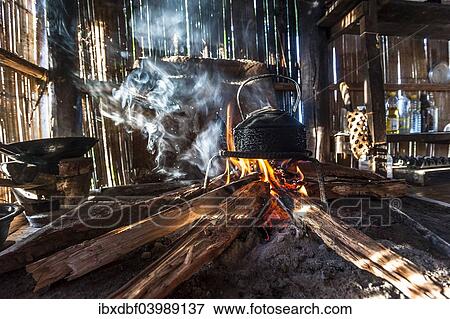 "Kettle over an open fire in a kitchen made of bamboo, Lahu village, province of Mae Hong Song, Northern Thailand, Thailand, Asia" View Large Photo Image Stock Photo - "Kettle over an open fire in a kitchen made of bamboo, Lahu village, province of Mae Hong Song, Northern Thailand, Thailand, Asia". Fotosearch