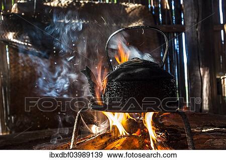 "Kettle over an open fire in a kitchen made of bamboo, Lahu village, province of Mae Hong Song, Northern Thailand, Thailand, Asia" View Large Photo Image Stock Photo - "Kettle over an open fire in a kitchen made of bamboo, Lahu village, province of Mae Hong Song, Northern Thailand, Thailand, Asia". Fotosearch