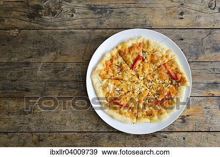 Kiln baked pizza on wooden table View Large Photo Image Stock Photo - Kiln baked pizza on wooden table. Fotosearch