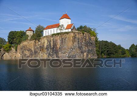Stock Photography - "Kirchberg or Church Hill with Church on the Hill and a water tower, Beucha, Brandis, Saxony, Germany, Europe". Fotosearch
