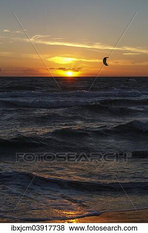 "Kitesurfer at sunset, Baltic Sea, Wustrow, Mecklenburg-Western Pomerania, Germany, Europe" View Large Photo Image Stock Photo - "Kitesurfer at sunset, Baltic Sea, Wustrow, Mecklenburg-Western Pomerania, Germany, Europe". Fotosearch