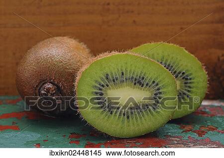 Stock Photography - "Kiwi fruits, whole and halved fruits". Fotosearch