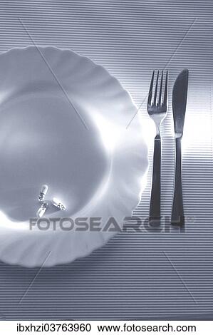 "Knife, fork and plate with capsules, slimming pills" View Large Photo Image Stock Image - "Knife, fork and plate with capsules, slimming pills". Fotosearch