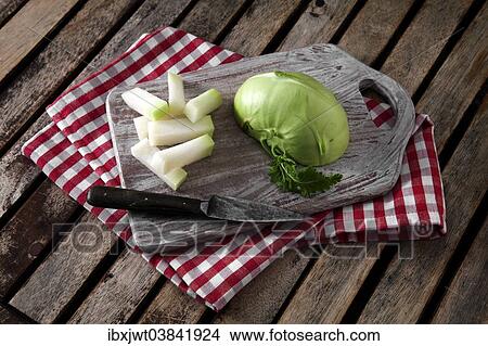 "Kohlrabi, cut on a wooden board" View Large Photo Image Picture - "Kohlrabi, cut on a wooden board". Fotosearch