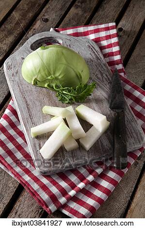 "Kohlrabi, cut ​​on wooden board" View Large Photo Image Stock Photo - "Kohlrabi, cut ​​on wooden board". Fotosearch