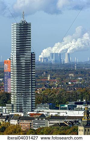 "Kolnturm tower in the Mediapark, Neurath coal-fired power plant of RWE at the back, Grevenbroich, Cologne, North Rhine-Westphalia, Germany, Europe" View Large Photo Image Stock Photo - "Kolnturm tower in the Mediapark, Neurath coal-fired power plant of RWE at the back, Grevenbroich, Cologne, North Rhine-Westphalia, Germany, Europe". Fotosearch