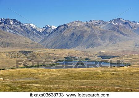 Stock Image - "Lake Alexandrina with the Ben Ohau Range and Range Gamack, Tekapo, Canterbury Region, New Zealand, Oceania". Fotosearch