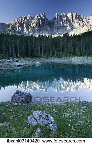 "Lake Carezza with Latemar Mountain, Karerpass, Dolomiten, South Tyrol province, Trentino-Alto Adige, Italy, Europe" View Large Photo Image Stock Image - "Lake Carezza with Latemar Mountain, Karerpass, Dolomiten, South Tyrol province, Trentino-Alto Adige, Italy, Europe". Fotosearch