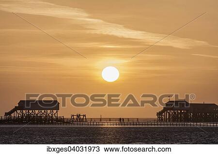 "Lake dwellings or stilt houses in the Wadden Sea, sunset, St. Peter-Ording, Eiderstedt, North Frisia, Schleswig-Holstein, Germany, Europe" View Large Photo Image Stock Image - "Lake dwellings or stilt houses in the Wadden Sea, sunset, St. Peter-Ording, Eiderstedt, North Frisia, Schleswig-Holstein, Germany, Europe". Fotosearch