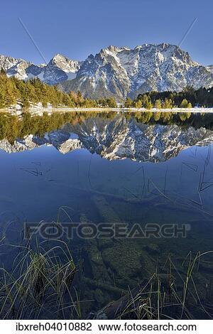 "Lake Luttensee and Westliche Karwendelspitze, Mittenwald, Bavaria, Germany, Europe" View Large Photo Image Stock Image - "Lake Luttensee and Westliche Karwendelspitze, Mittenwald, Bavaria, Germany, Europe". Fotosearch