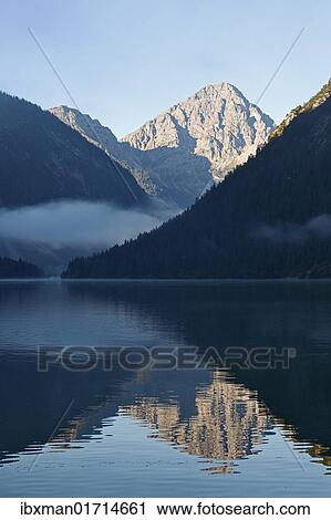 Stock Image - "Lake Plansee and Ammergebirge mountains, in the back Mt. Thaneller in the Lechtal Alps, Tyrol, Austria, Europe". Fotosearch