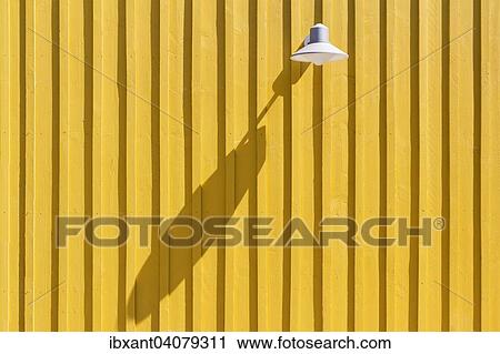 "Lamp on a yellow beach hut casting a long shadow, Ile d? ÇÖOleron, Charente Maritime, Poitou-Charentes, France, Europe" View Large Photo Image Stock Image - "Lamp on a yellow beach hut casting a long shadow, Ile d? ÇÖOleron, Charente Maritime, Poitou-Charentes, France, Europe". Fotosearch