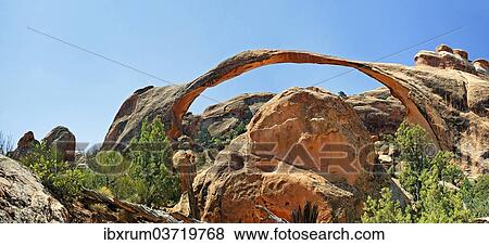 Stock Photo - "Landscape Arch, stone arch made of red sandstone formed by erosion, Arches-Nationalpark, near Moab, Utah, United States, North America". Fotosearch