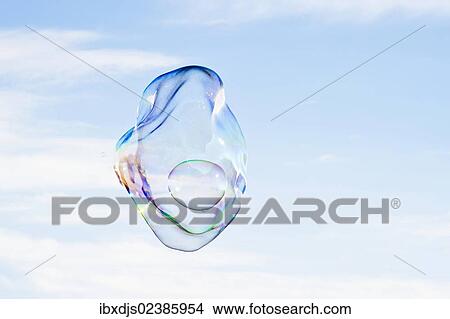 Large soap bubbles in front of a bright blue sky View Large Photo Image Picture - Large soap bubbles in front of a bright blue sky. Fotosearch