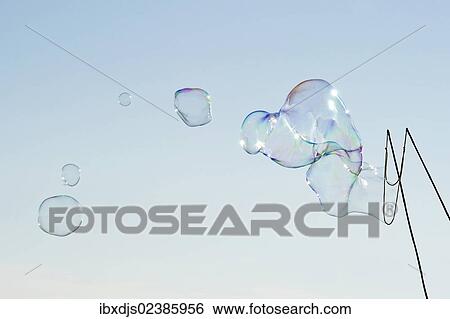 Large soap bubbles in front of a bright blue sky View Large Photo Image Stock Photograph - Large soap bubbles in front of a bright blue sky. Fotosearch