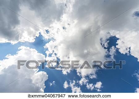 Large white clouds against a blue sky View Large Photo Image Stock Photo - Large white clouds against a blue sky. Fotosearch