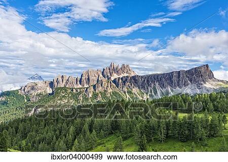Stock Photo - "Lastoi de Formin mountain with blue sky and clouds, Croda da Lago at the back, Dolomites, Veneto, Italy, Europe". Fotosearch