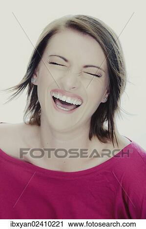 Stock Image - "Laughing young woman, portrait". Fotosearch