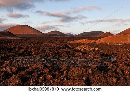 "Lava field, Fire Mountains, volcanoes, volcanic landscape, evening light, Timanfaya National Park, Lanzarote, Canary Islands, Spain, Europe" View Large Photo Image Stock Image - "Lava field, Fire Mountains, volcanoes, volcanic landscape, evening light, Timanfaya National Park, Lanzarote, Canary Islands, Spain, Europe". Fotosearch