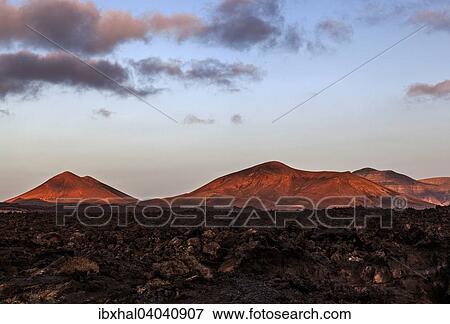 "Lava field, Fire Mountains, volcanoes, volcanic landscape, evening light, Lanzarote, Canary Islands, Spain, Europe" View Large Photo Image Stock Photo - "Lava field, Fire Mountains, volcanoes, volcanic landscape, evening light, Lanzarote, Canary Islands, Spain, Europe". Fotosearch