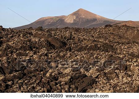 "Lava field, volcanic landscape, Guardilama volcano at the back, Lanzarote, Canary Islands, Spain, Europe" View Large Photo Image Stock Photo - "Lava field, volcanic landscape, Guardilama volcano at the back, Lanzarote, Canary Islands, Spain, Europe". Fotosearch