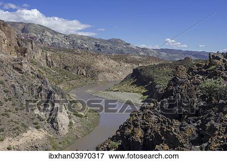 "Lava of the Cerro Payun volcano and the Grande river, Mendoza province, Argentina, South America" View Large Photo Image Stock Photo - "Lava of the Cerro Payun volcano and the Grande river, Mendoza province, Argentina, South America". Fotosearch