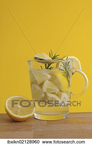 "Lemon pieces, rosemary, lemon juice, lemon tea, tea glass" View Large Photo Image Stock Image - "Lemon pieces, rosemary, lemon juice, lemon tea, tea glass". Fotosearch