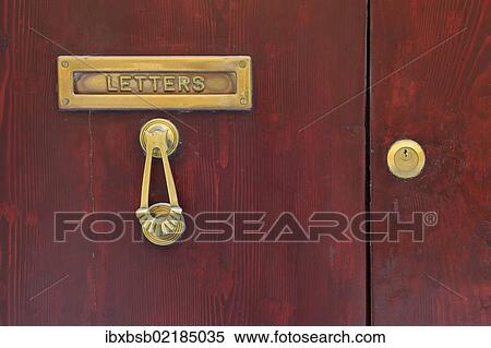 Stock Photography - "Letter slot and door knocker on the front door of a house, Valletta, Malta, Europe". Fotosearch
