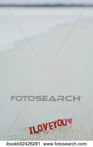 "Lettering """"I love you"""" on a sandy beach" View Large Photo Image Stock Image - "Lettering """"I love you"""" on a sandy beach". Fotosearch