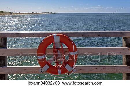 "Lifebuoy on a wooden railing, Wustrow, Fischland-Darss-Zingst, Mecklenburg-Western Pomerania, Germany, Europe" View Large Photo Image Stock Image - "Lifebuoy on a wooden railing, Wustrow, Fischland-Darss-Zingst, Mecklenburg-Western Pomerania, Germany, Europe". Fotosearch