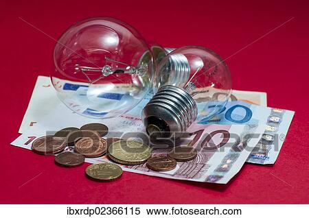 Light bulbs with euro banknotes and small change View Large Photo Image Stock Photography - Light bulbs with euro banknotes and small change. Fotosearch