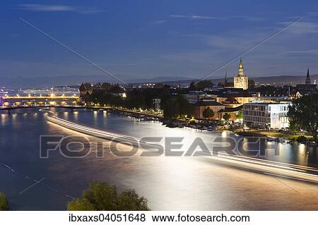 Stock Photo - "Light tracers of ships on the Rhine River during the Seenachtfest Festival, Constance Minster at the rear, Konstanz, Baden-Wurttemberg, Germany, Europe". Fotosearch