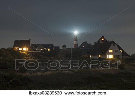 Stock Image - "Lighthouse and thatched houses at night, Hornum, Westerland, Sylt, North Frisia, Sylt, North Frisian Islands, Schleswig-Holstein, Germany, Europe". Fotosearch