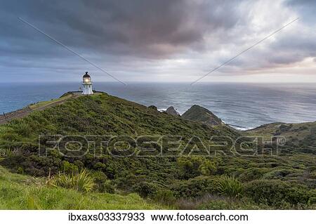 Stock Image - "Lighthouse at Cape Reinga at dawn, Cape Reinga, Northland Region, New Zealand, Oceania". Fotosearch