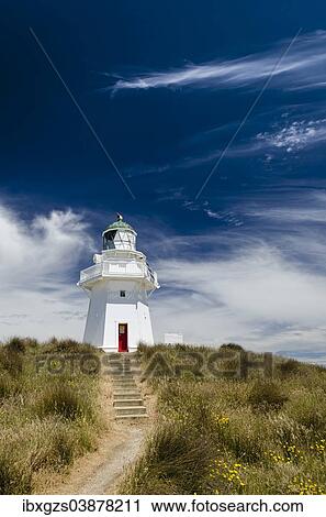 Stock Image - "Lighthouse with path and stairs at Waipapa Point, Otara, Fortrose, Southland Region, South Island, New Zealand, Oceania". Fotosearch