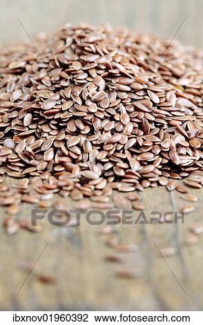 Linseeds on wooden underground View Large Photo Image Stock Image - Linseeds on wooden underground. Fotosearch