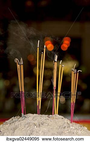 Stock Photography - "Lit incense sticks, Wat Phnom Temple, Phnom Penh, Cambodia, Southeast Asia, Asia". Fotosearch