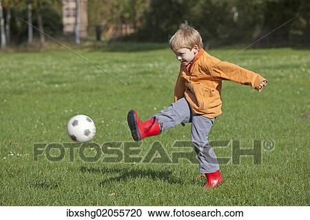 Little boy playing soccer View Large Photo Image Stock Image - Little boy playing soccer. Fotosearch
