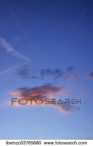 "Little cloud against blue sky, lit by the setting sun, Middle Franconia, Bavaria, Germany, Europe" View Large Photo Image Stock Image - "Little cloud against blue sky, lit by the setting sun, Middle Franconia, Bavaria, Germany, Europe". Fotosearch