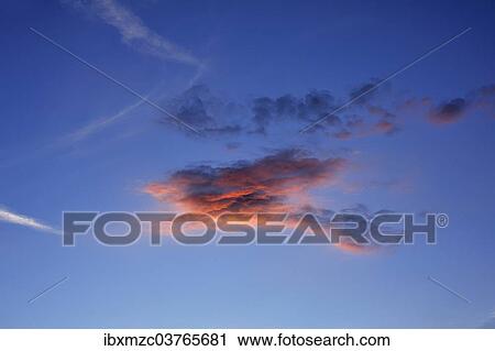 "Little cloud against blue sky, lit by the setting sun, Middle Franconia, Bavaria, Germany, Europe" View Large Photo Image Stock Image - "Little cloud against blue sky, lit by the setting sun, Middle Franconia, Bavaria, Germany, Europe". Fotosearch