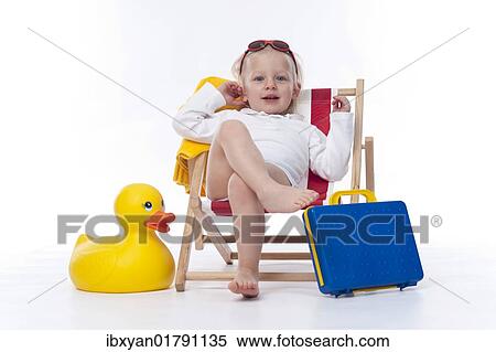 Little girl with sunshades in beach chair View Large Photo Image Stock Photography - Little girl with sunshades in beach chair. Fotosearch