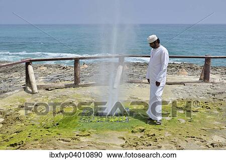 "Local man watching Blow Hole in Mughsayl, Dhofar Region, Oman, Asia" View Large Photo Image Stock Image - "Local man watching Blow Hole in Mughsayl, Dhofar Region, Oman, Asia". Fotosearch