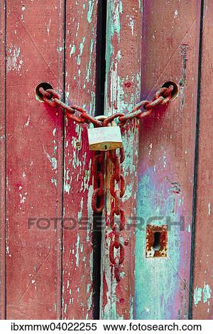 "Lock on a chain, wood door" View Large Photo Image Stock Photography - "Lock on a chain, wood door". Fotosearch